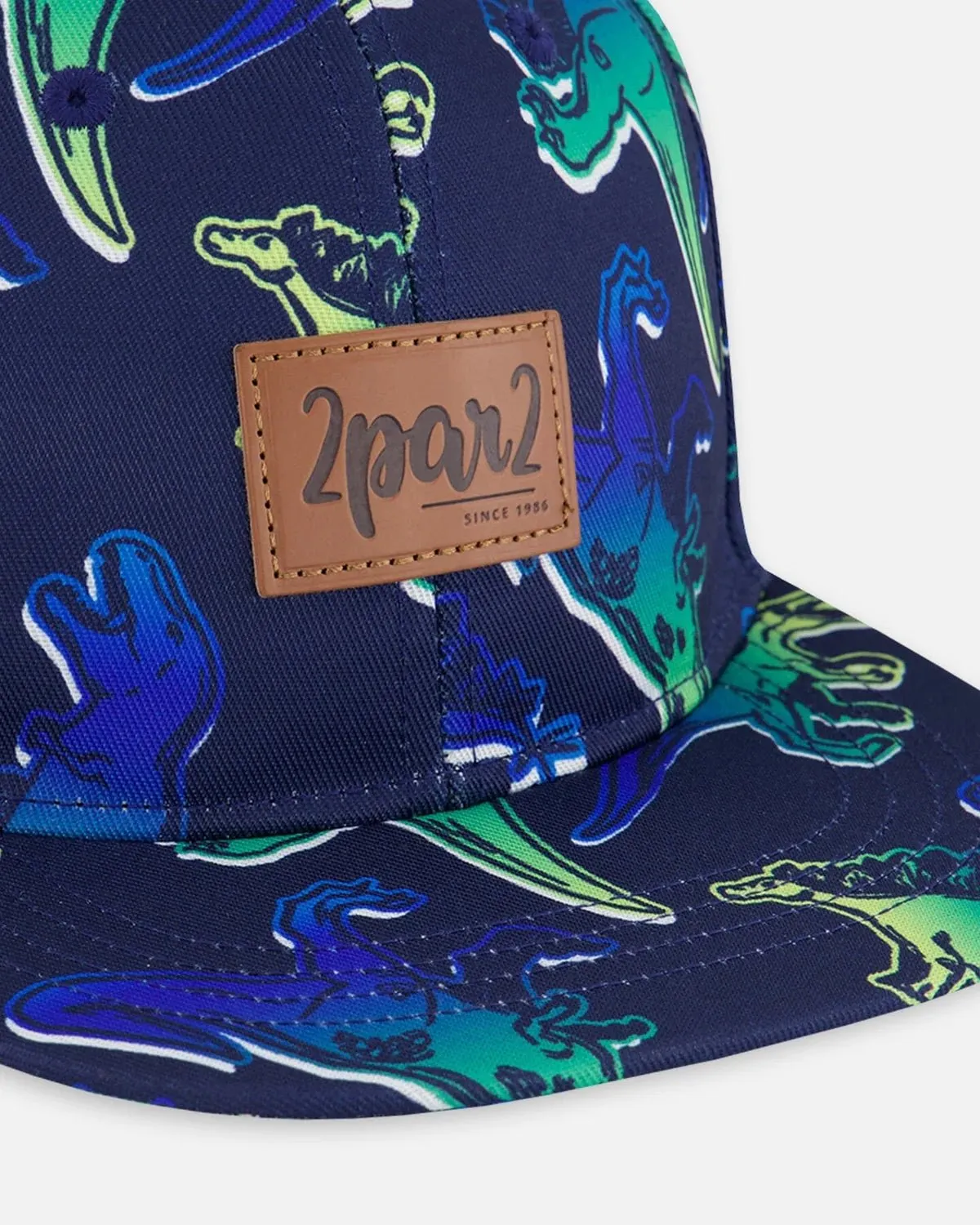 Deux par Deux - Printed Cap Blue And Green Dino On Navy